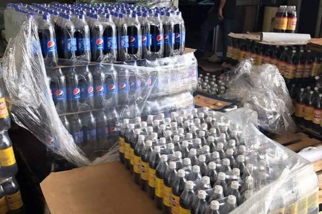 التموين تغلق المستودع الرئيسي لشركة جود للمشروبات الغازية لرفعها أسعار منتجاتها 